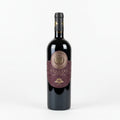 Wine bottle with a decorative Saudens Rosso label on a white background