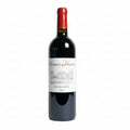 Red wine bottle with a Charmes de Kirwan Margaux label on a white background