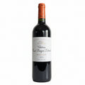 Red wine bottle with a Chateau Haut-Bages Liberal label on a white background