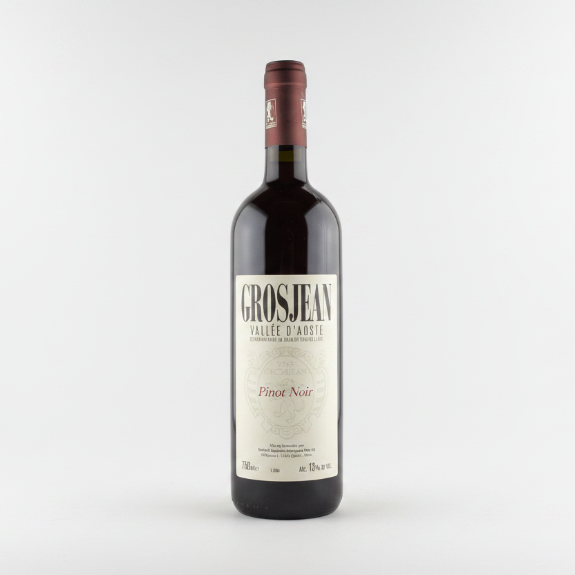 Bottle of Grosjean Pinot Noir wine on a green background
