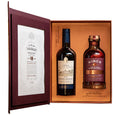 Two bottles of alcohol in a decorative box with Hinch 18 Year old irish whiskey labels visible
